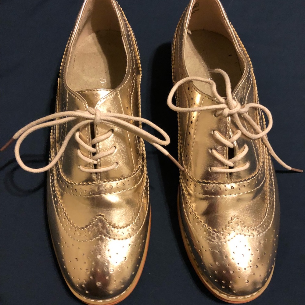 Wing-tip gold shoes. Never worn.